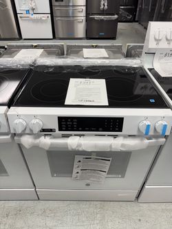 White 30” electric slide in range with convection and air fly