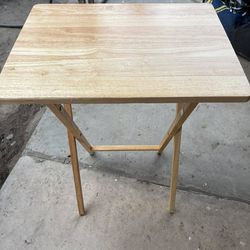 Small folding wood table and wood storage
