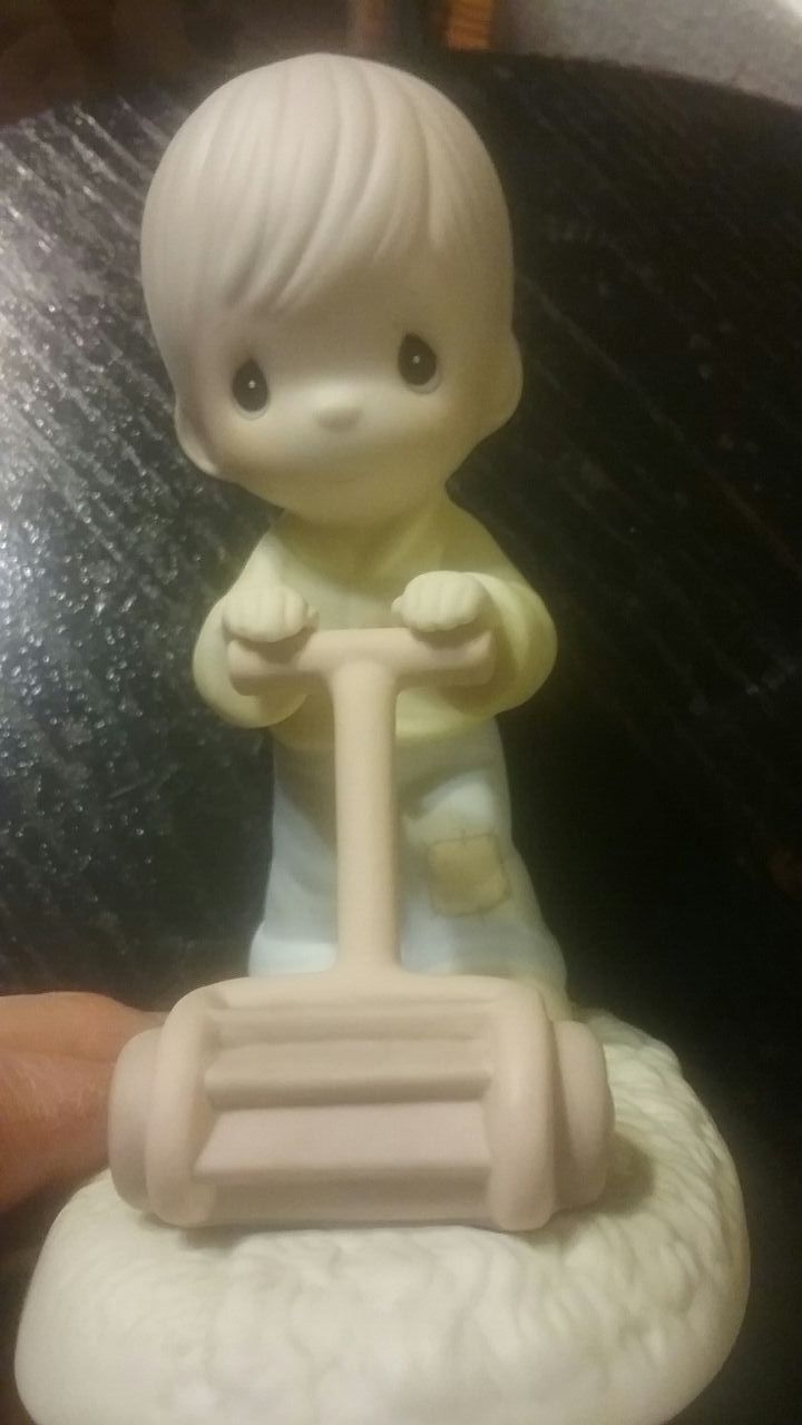 Precious Moments " Mow Power to Ya" figurine.