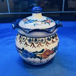 Vintage beautiful hand painted ceramic jar with matching ruffled lid.