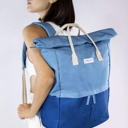 Kind Bag London “Hackney” 2.0 Backpack. Light Blue & Navy. Large 100% recycled. 23 L. 22x18x6". Carry Handles.Roll top.Water resistant.Zipper & Magnet