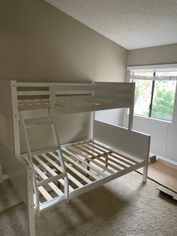 Twin/full bunk bed. Available in black & white. Tax included . Free local delivery .  $350 for bunk bed only. $550 with mattresses.  Assembly required