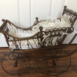 Antique stroller with baby doll