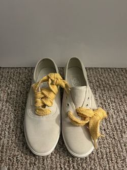 Vans Women’s Low-Top Canvas Sneakers in Cream with Yellow Laces