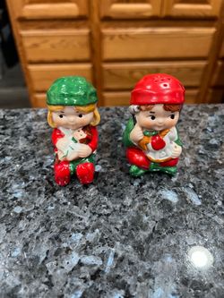 Vintage 1981 Avon Christmas Elf Pair of Salt and Pepper Shakers. Size approximately 2 1/2 inches tall. Preowned never used. The bottom has stamped