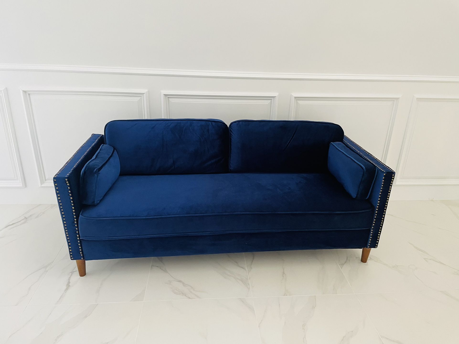 Blue velvet sofa