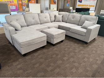 Light gray reversible sectional w/ ottoman
