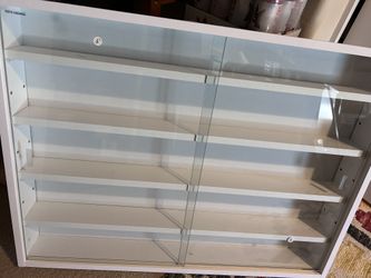 Wall shelves with sliding glass doors