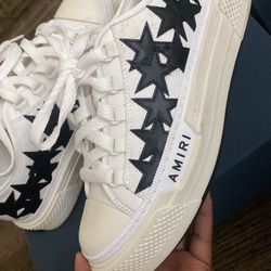White and black Amiri trainers