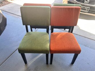 Four green and orange table chairs