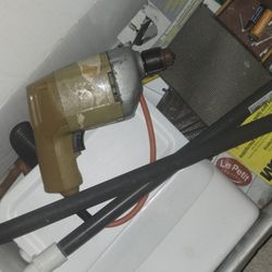 Drill With A Box Of Tools 
