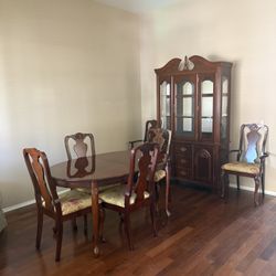 Table, chairs, and cabinet set.