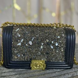 Black Shoulder Bag With A Chain And Leather Strap And Gold Hardware 