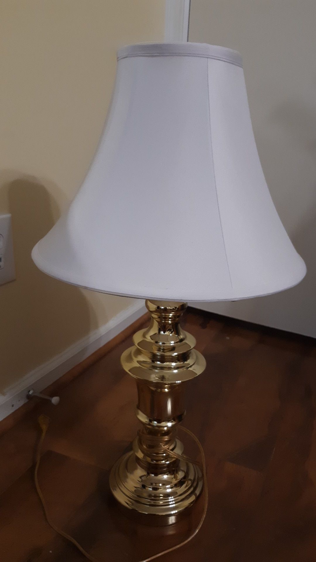 Working gold lamp with white shade