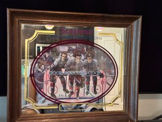 Vintage Seagrams Seven Crowns of Sports Collection hockey mirror. Cook, Boucher, Cook. Figural motif on mirror with wood frame. Measures approx. 17.75