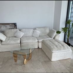 Beige Couch With Clear Table Plus A Matching Chair