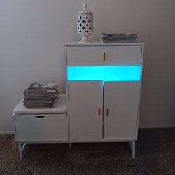 White Bedroom Cabinet With Electric Plug Ins & Colored Lights. 
