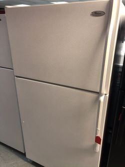 Used whirlpool 18 cu ft top and bottom fridge. 1 year warranty
