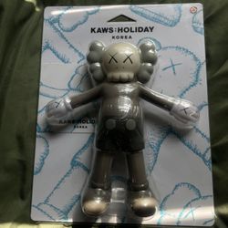 Kaws Holiday Figurine