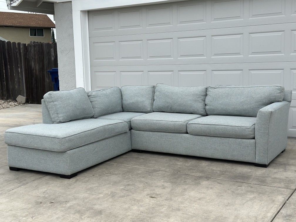 Free Delivery/ Sectional Sofa by Living Spaces