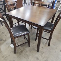 42 / 42 inch pub table with 4 chairs, dark brown all wood.