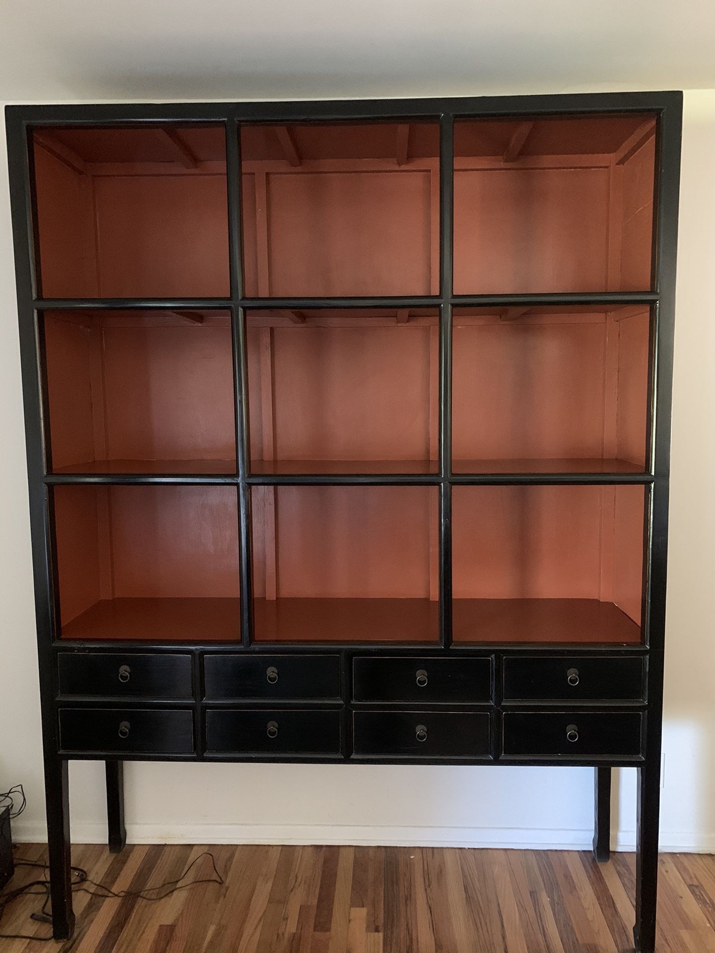 Large living room statement piece with great function! There are 8 separate drawers for storage and large shelves for books, photos and mementos.