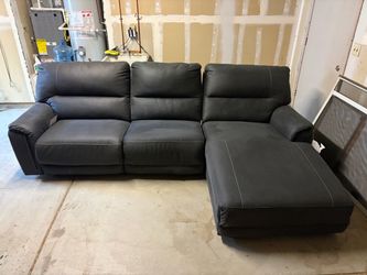 Sectional sofa with power chase and recliner.