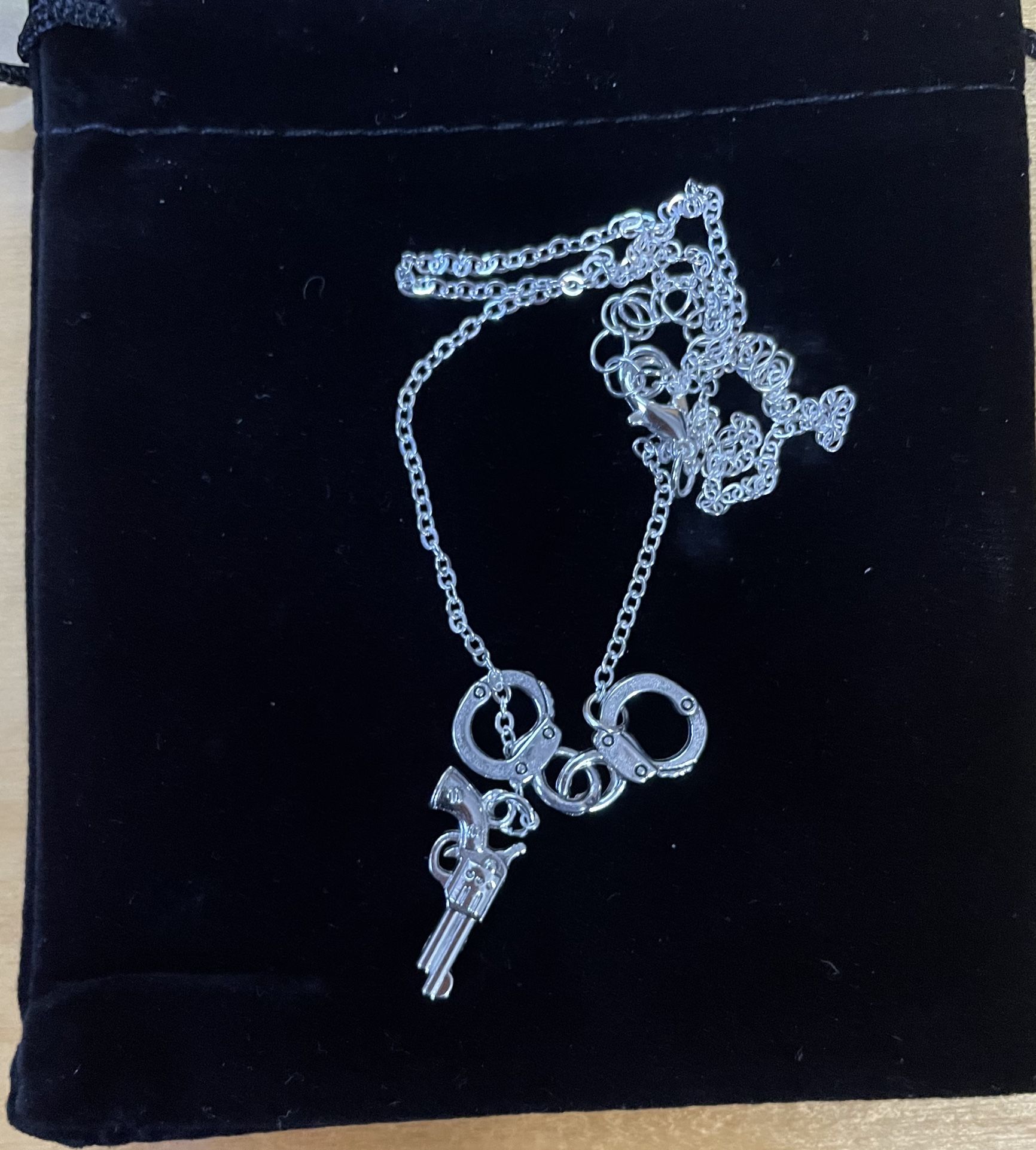 New Gun And Handcuffed Necklace….beautiful