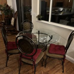 Glass Dining Table And Four Metal Chairs