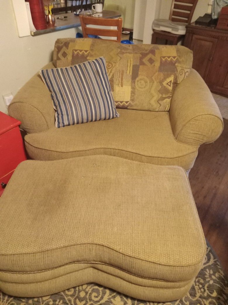 Oversized Chair With Rolling Footstool