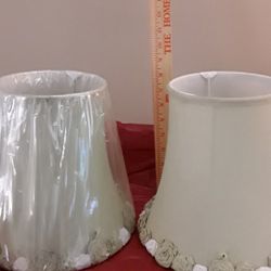 Beautiful antique lamp shades. Nine inches high, about six and half inches across. Trimed in roses.