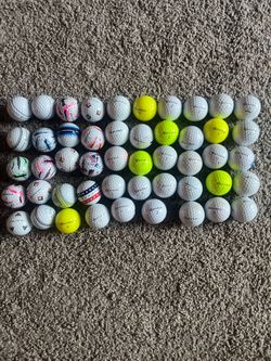 49 used Taylor Made Golf balls