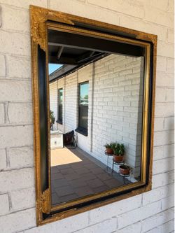 Vintage gilded gold style and black lacquered wall mirror