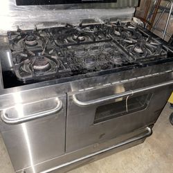 stainless steel industrial  6 burner stove  Brand Frigidaire  Works great.    