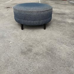 Blue upholstered Ottoman