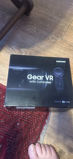 This is a Samsung Gear VR virtual reality headset with a controller