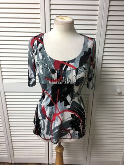 Size small, short sleeve blouse, pleated chest, ties in the back, sparkles throughout