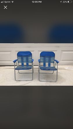 Two blue metal folding kids chairs