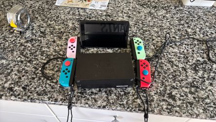Nintendo switch with a extra pair of controllers