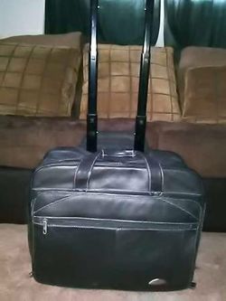 Vtg.Samsonite leather briefcase on wheels* pull out handle*great shape - $75