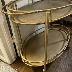 Gold meta l serving tray on wheels 70