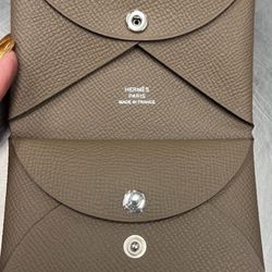 LIKE NEW PREOWNED AUTHENTIC HERMES CALVI DUO CARD HOLDER IN ETOUPE COLOR. RETAIL $570 + Tax