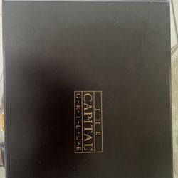 Brand new Capital Grille steak knives in a wooden box