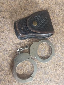 Vintage peerless police handcuffs with holster
