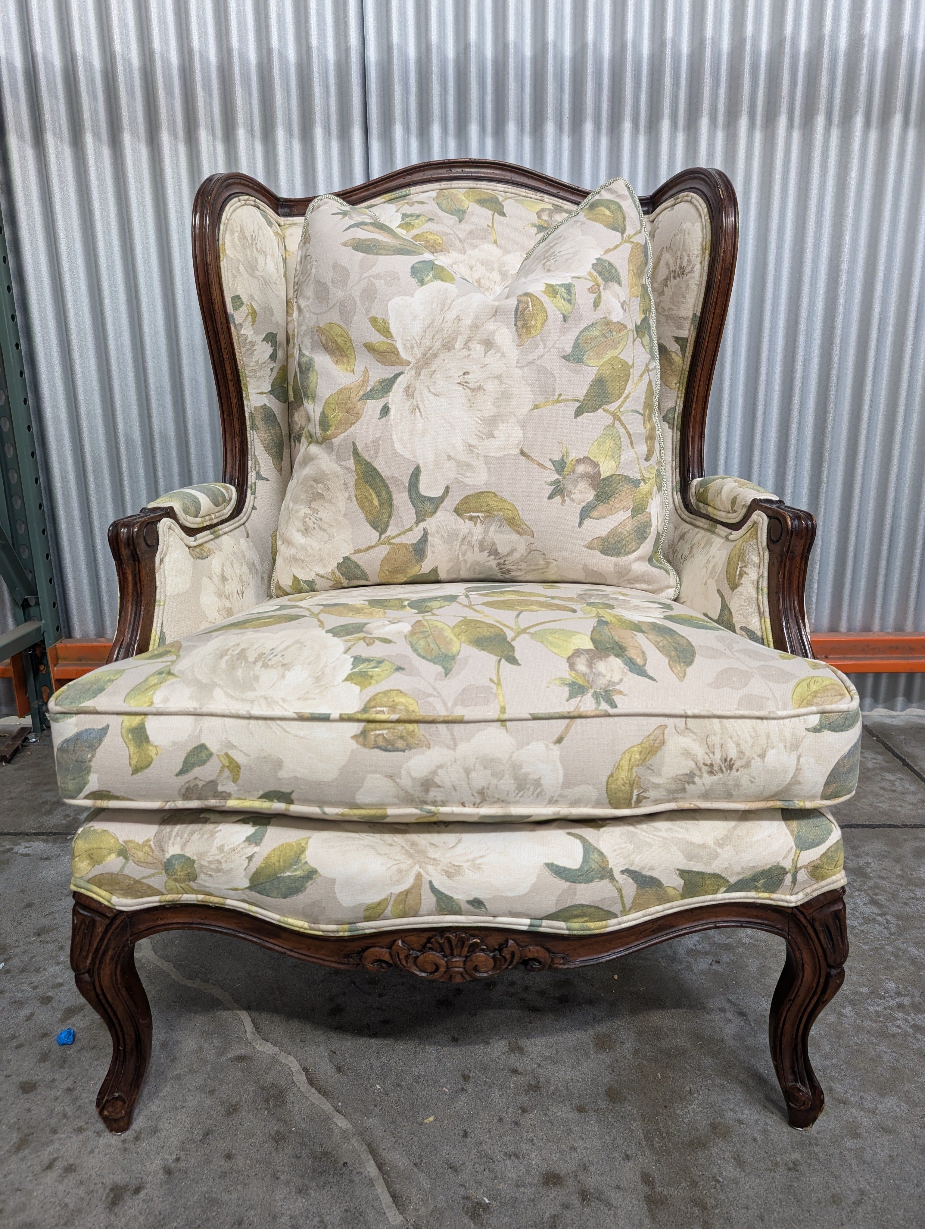 Vintage Wingback Armchair with Floral Upholstery and Carved Wood Frame