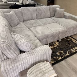 NEW SECTIONAL WITH PULL OUT BED AND STORAGE 