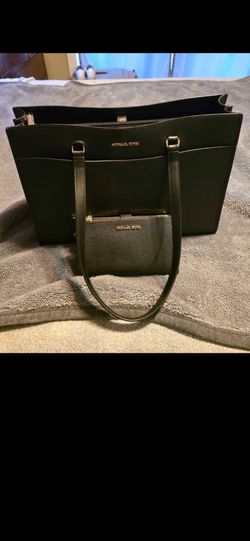 I have a micheal kor black purse with a matching wallet