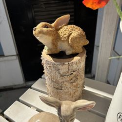 Rabbit Sitting On Wood Candle Holder