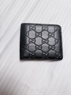 Gucci GG Embossed Leather Bifold Wallet