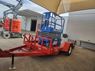 Genie Scissor Lift And Tilt Deck Trailer